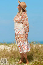 Floral print long-sleeved Khaki Plus Size dress with tan hat and ankle boots for relaxed styles