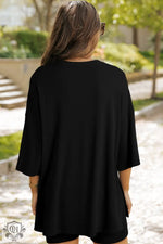 Loose-fitting black tunic with elbow-length sleeves from Light Grey Solid Color set, relaxing style