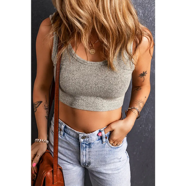 Gray sleeveless crop top with light-wash denim jeans, perfect for relaxed styling