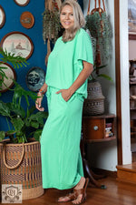 Woman in a mint green lounge set from Mint Green Textured Batwing Sleeve Tee Wide Leg Pants Plus Size Set