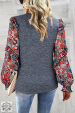 Gray sweater with floral print balloon sleeves in red and blue tones, sizes bust hem