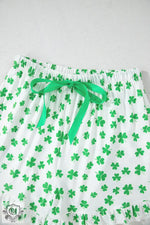 White shorts with green shamrock pattern and drawstring bow, perfect for Euro sizes in pajamas