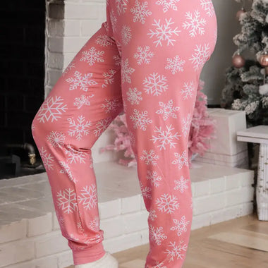 Pink pajama pants with snowflake print for cozy relaxation in festive loungewear