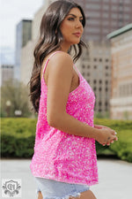 Hot pink sequined tank top with adjustable straps in various sizes for relaxed fit