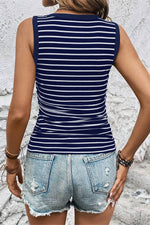 Navy and white striped sleeveless top with distressed denim shorts for relaxed styles