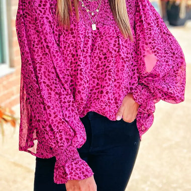 Bright fuchsia leopard print blouse with balloon sleeves and mock neckline in various sizes