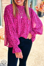 Bright fuchsia leopard print blouse with balloon sleeves and mock neckline in various sizes