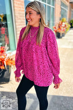 Bright fuchsia leopard print blouse with puff sleeves available in various sizes bust hem