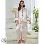 Pale pink satin long sleeve lounge set with elegant black trim for a stylish look