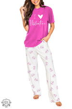 Pink and white Valentine’s Day pajama set with heart t-shirt and Christmas tree pants