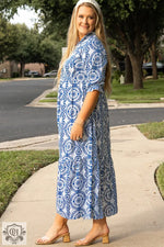 Woman in blue and white geometric print dress showcasing the Sky Blue Maxi Dress relax 1x 14w-16w