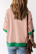 Orange and white striped t-shirt with green trim, perfect for casual relax relax style