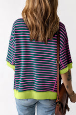 Striped navy pink t-shirt with neon yellow trim styled with blue jeans for relaxed look