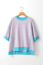 Striped pink and turquoise sweatshirt on hanger, perfect for relaxed styling in all sizes