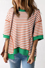 Orange and white striped sweater with green trim, perfect for sizes bust hem relaxation