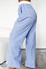 Blue and white striped wide leg drawstring pants for a relaxed and stylish look