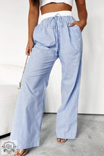 Light blue and white striped wide leg pants with drawstring waist for a relaxed look