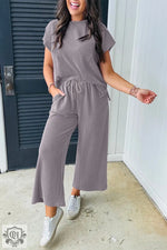 Woman in Smoke Gray Solid Corded Knit Short Sleeve T Shirt and Wide Leg Pants Set relaxing