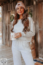 Cozy cream sweater and beanie with coffee, perfect for a Relax Relax lounge style