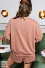 Dusty pink loungewear set for relaxing, featuring sweatshirt and shorts in euro sizes