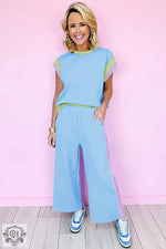 Woman in a blue and pastel lounge set featuring Strawberry Pink Color Block Detail