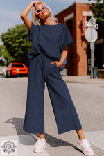 Navy blue two-piece pantsuit showcasing loose fit for stylish relaxed comfort