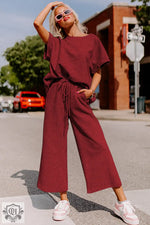 Burgundy knit lounge set featuring a loose fit T-shirt and drawstring pants for relaxation