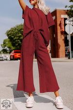 Burgundy two-piece pantsuit offers a stylish loose fit for relaxed occasions