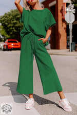 Green two-piece lounge set featuring a loose fit T-shirt and drawstring pants for relaxation