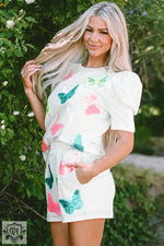 White romper with pink and turquoise butterfly print perfect for relaxed outings in various sizes