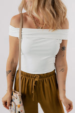 White Folded Off Shoulder Slim Top with brown drawstring pants for relaxed style