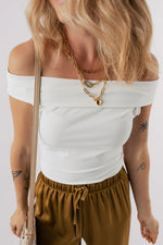 Off-shoulder white crop top with brown drawstring pants, perfect for casual relax wear