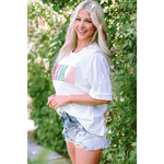 White MAMA Chenille Patched Crew Neck T Shirt with pastel text and distressed denim shorts