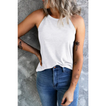 White solid color crew neck tank top paired with blue jeans for a stylish look