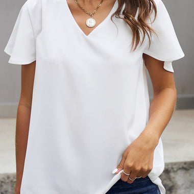 White V-neck blouse with flutter sleeves and blue jeans in sizes bust waist relax relax