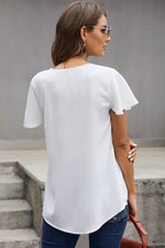 White flutter sleeve v-neck blouse with curved hemline for relaxed styles in all sizes