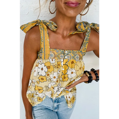 Floral tank top with yellow bow straps paired with denim jeans in various sizes